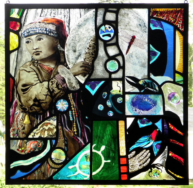 psychedelic collage of shamanic imagery make up this stained glass window icluding a Siberian healer  with a drum